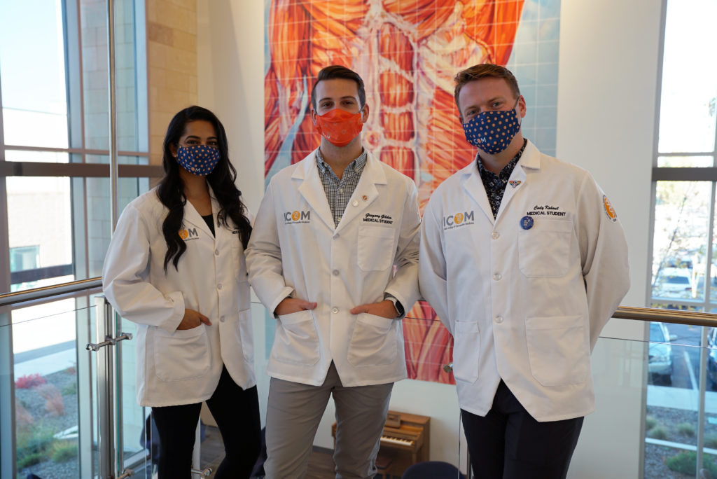 Three students wearing face masks.
